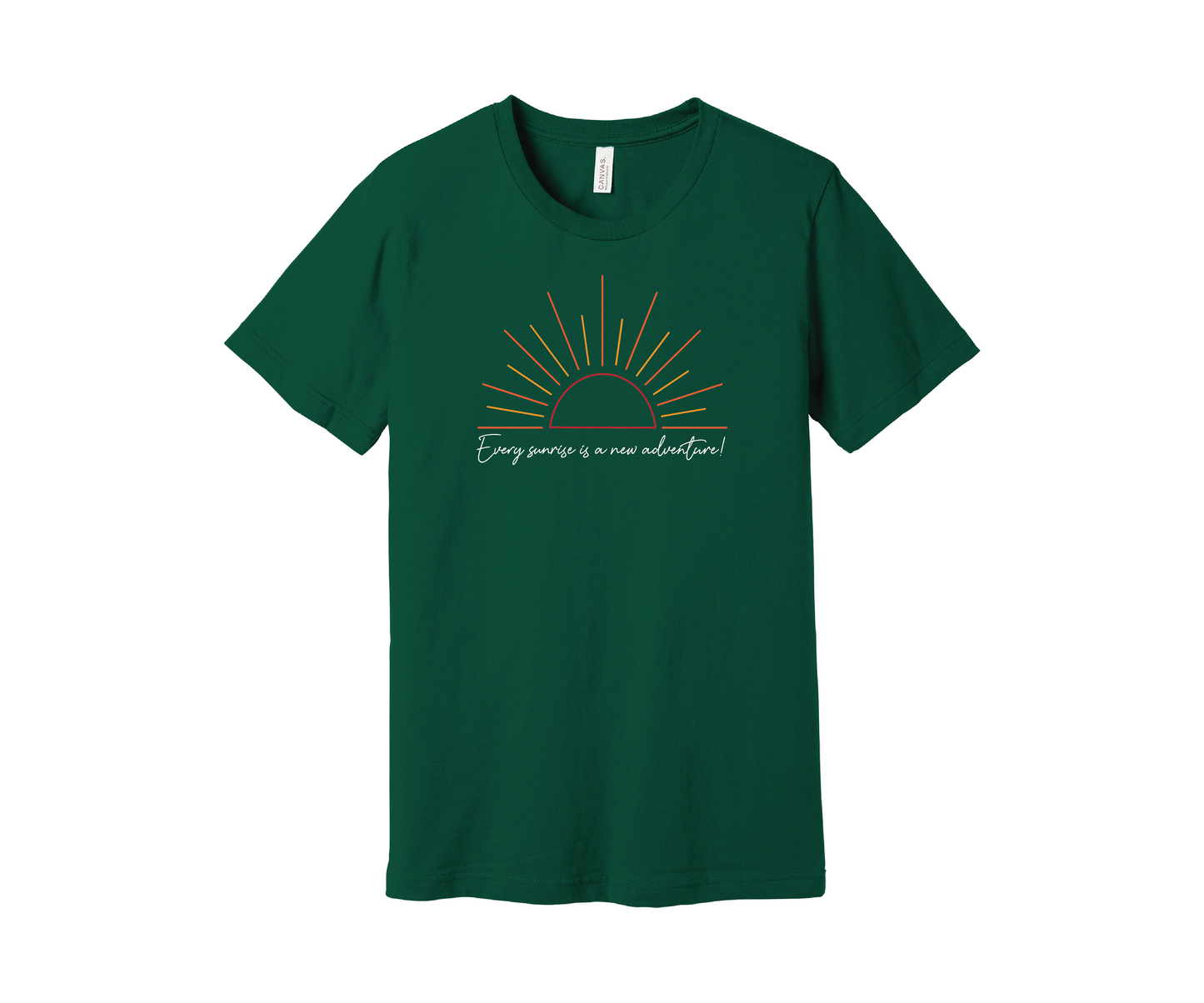 An evergreen-colored T-shirt features a graphic of a stylized orange and yellow sunrise above a handwritten cursive message in white that reads, "Every sunrise is a new adventure!" The shirt has a simple and modern design.