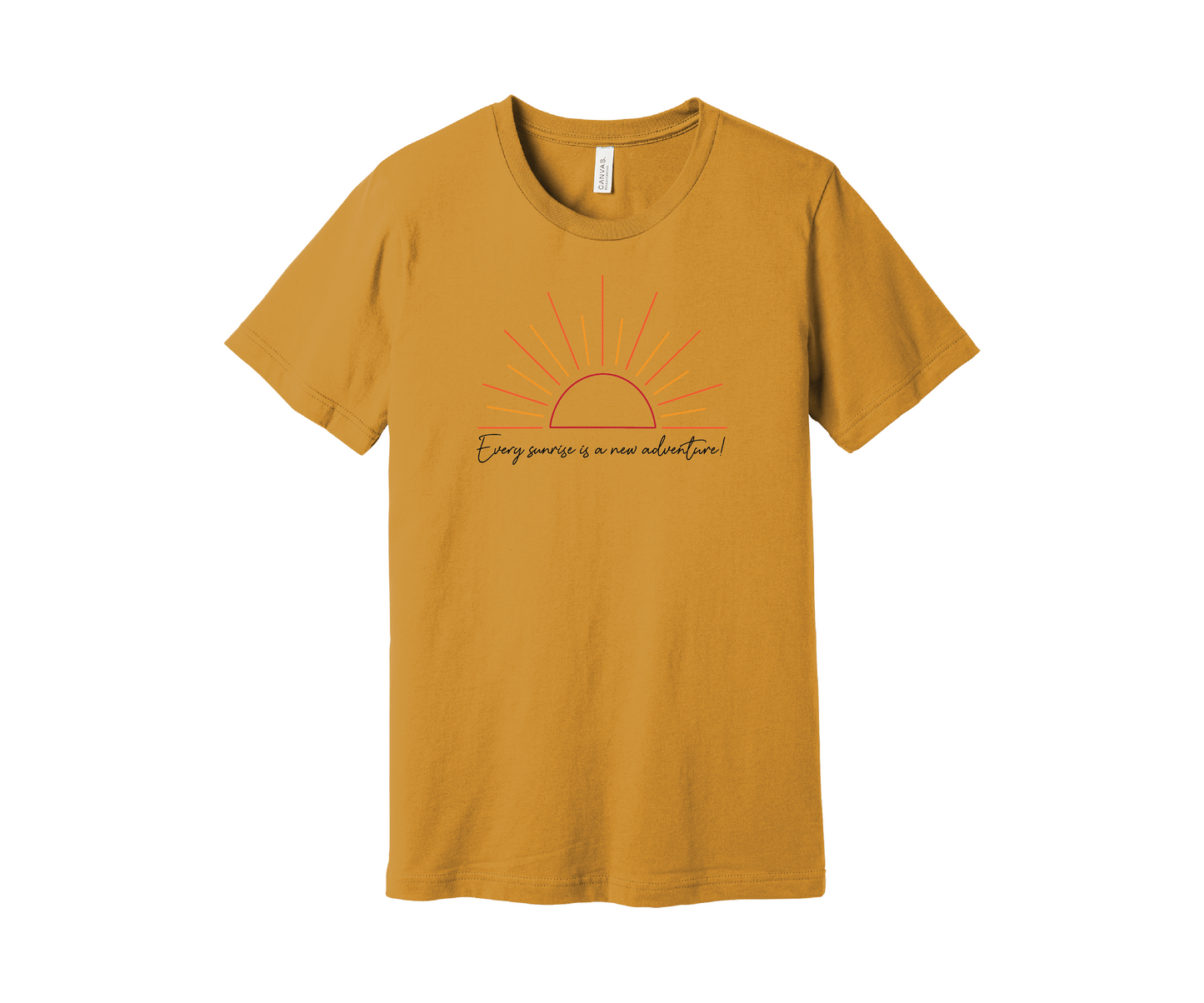 A dusky yellow T-shirt features a graphic of a stylized orange and yellow sunrise above a handwritten cursive message in black that reads, "Every sunrise is a new adventure!" The shirt has a simple and modern design.