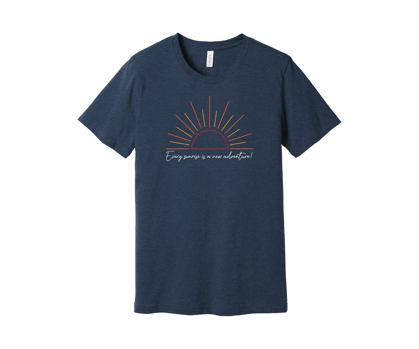 A navy heather T-shirt features a graphic of a stylized orange and yellow sunrise above a handwritten cursive message in white that reads, "Every sunrise is a new adventure!" The shirt has a simple and modern design.