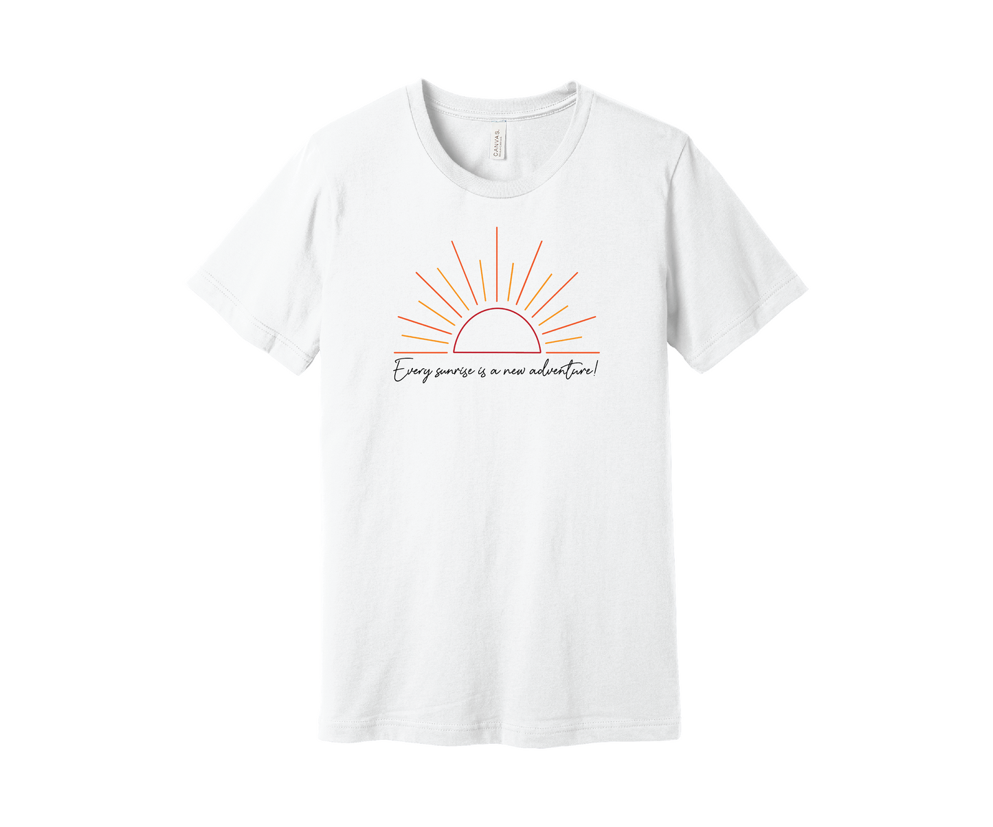 A white T-shirt features a graphic of a stylized orange and yellow sunrise above a handwritten cursive message in black that reads, "Every sunrise is a new adventure!" The shirt has a simple and modern design.