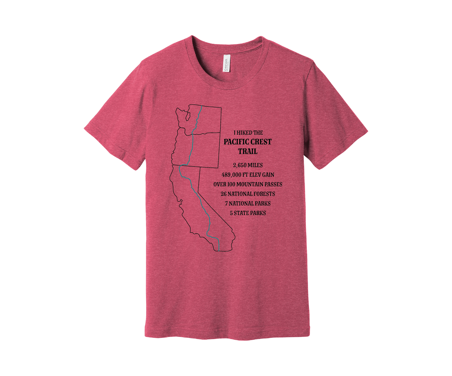 A pink heather T-shirt displays a black map outline of the states of California, Oregon and Washington and the route of the Pacific Crest Trail in teal. Text on the shirt reads: "I Hiked the Pacific Crest Trail," and lists details: 2,650 miles, 489,500 ft elevation gain, Over 60 Mountain Passes, 28 National Forests, 7 National Parks, 5 State Parks.