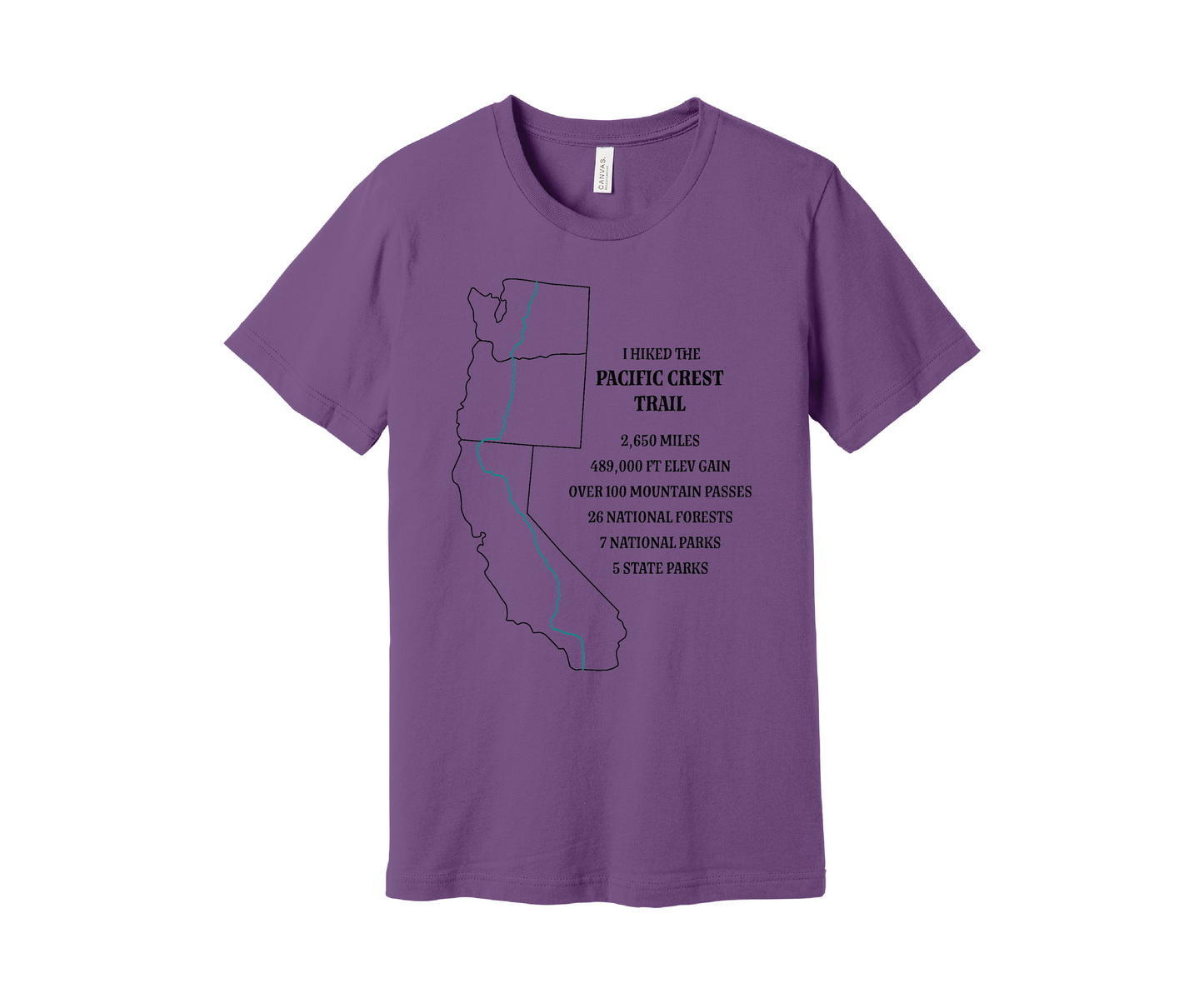 A light purple T-shirt displays a black map outline of the states of California, Oregon and Washington and the route of the Pacific Crest Trail in teal. Text on the shirt reads: "I Hiked the Pacific Crest Trail," and lists details: 2,650 miles, 489,500 ft elevation gain, Over 60 Mountain Passes, 28 National Forests, 7 National Parks, 5 State Parks.